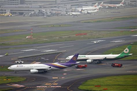 Runway closed at Tokyo’s Haneda airport after 2 planes bump into each other